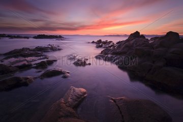 Twilight on the rocky shores of Dramont France