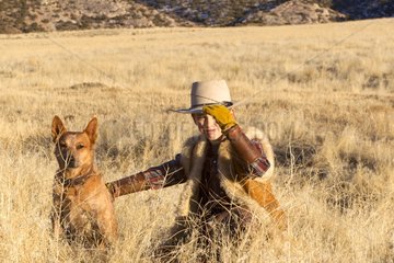 Young Cowboy with an Australian Cattle Dog Wyoming USA