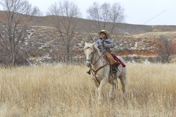 Young Cowboy riding a Quarter Horse in Wyoming USA