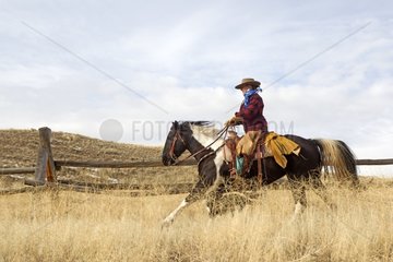 Cowboy riding a Quarter Horse in Wyoming USA