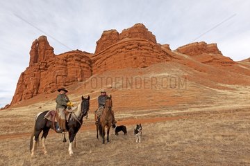 Cowboys on their Quarter Hose in winter Wyoming USA