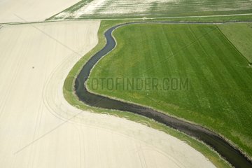 Meandering channel between field and meadow - Somme France
