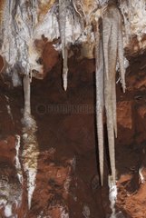Red clay and calcite stalactites Baoumo Rousso France