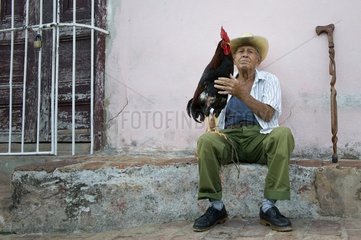 An old man with his pet at Trinidad Cuba