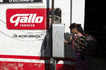 Woman calling before a beer advertising Guatemala