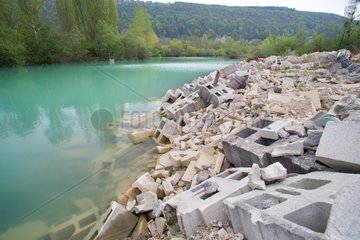 Deposit of debris on the banks of a river France