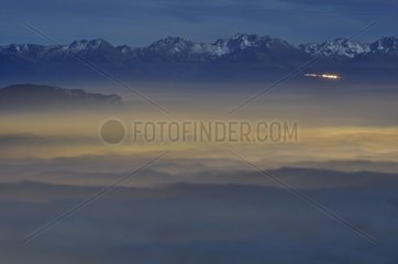 Sea of clouds in the moonlight above Chambéry France