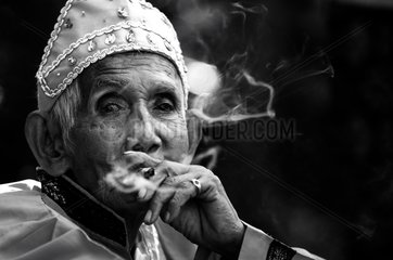 Former village smoking a cigarette Banda Indonesia