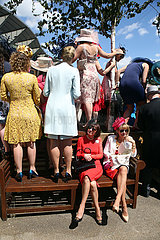 Royal Ascot  Fashion on Ladies Day  women with hats at the racecourse waiting for the Queen