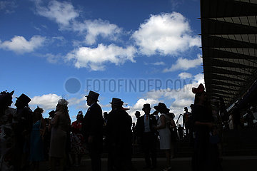 Royal Ascot  Fashion  audience with hats silhouetted against the sky