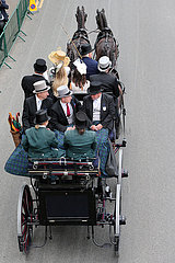 Royal Ascot  People in a carriage on their way to the racecourse on Ascot High Street