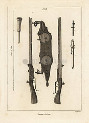 Ancient double-charge carbine with two flintlocks.