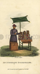 An itinerant bookseller selling tales and song-books for the lower orders from a stall.