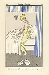 Woman in yellow chiffon night gown and hat getting into bed.