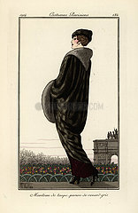 Woman in long coat of grey fox fur.