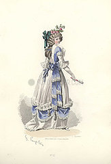 Woman in long white silk dress with blue ribbon decorations
