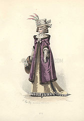 Woman in bonnet trimmed with feathers  long golden silk dress  mauve fur-trimmed hooded coat and fur muffler.