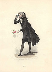 Dandy in black suit  breeches and stockings  holding a sprig of flowers and looking through a pocket telescope.