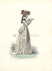 Fashionable woman in bonnet  wearing a floral print long dress and reading a book.