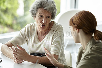 Senior patient talking with her daughter
