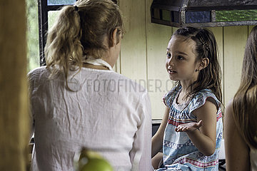 Girl talking with her grandmother