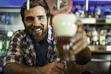 Man holding beer glass