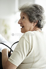Senior woman sitting in the clinic