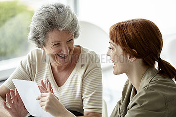 Mother and daughter holding prescription