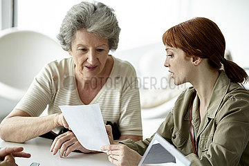 Mother and daughter reading prescription