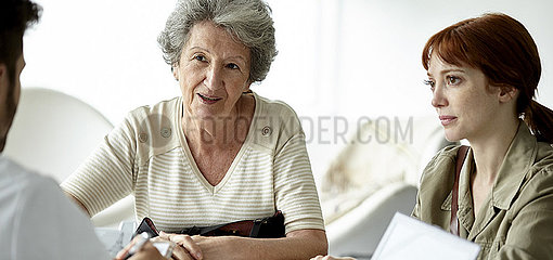 Senior patient talking with doctor