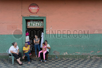 family in front of their house in nicaragua