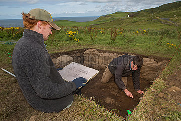 archaeologists working at dunluce castle