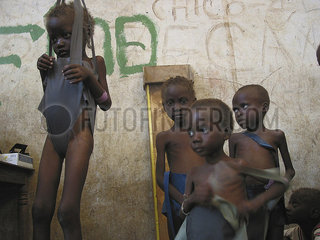 Young children are weighed at an MSF feeding clinic. Feeding centres and other humanitarian aid were organised in Angola after widescale malnutrition during and following the countrys civil war.
