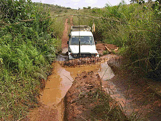 An MSF vehicle navigates muddy roads in Angola. Feeding centres and other humanitarian aid were organised in Angola after widescale malnutrition during and following the countrys civil war.