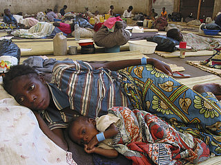 A malnourished mother and child resting in a feeding centre. Feeding centres and other humanitarian aid were organised in Angola after widescale malnutrition during and following the countrys civil war.