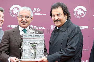 Chantilly  Prince Saud bin Khalid Abdullah (right) gets the trophy from H.H. Sheikh Abdullah bin Kalifa al Thani after winning the Qatar Prix de l'Arc de Triomphe