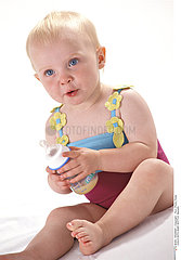 CHILD WITH BABY BOTTLE
