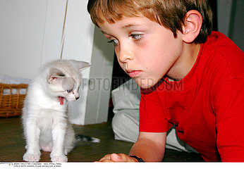 CHILD WITH ANIMAL