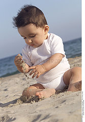 INFANT PLAYING OUTDOORS