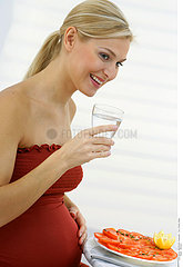 PREGNANT WOMAN WITH A DRINK
