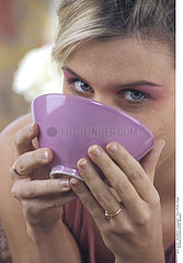 WOMAN EATING SOUP