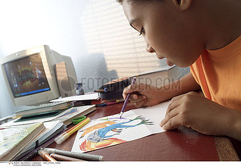CHILD DRAWING INDOORS