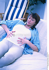 PREGNANT WOMAN IN PAIN  INDOORS