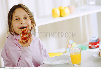 CHILD EATING BREAKFAST