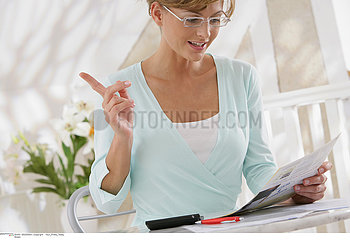 WOMAN DOING PAPERWORK