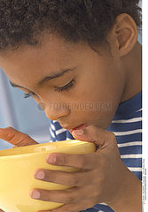 CHILD EATING BREAKFAST