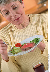 ELDERLY PEOPLE EATING A MEAL