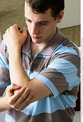 MAN WITH PAINFUL ELBOW