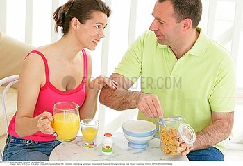 COUPLE EATING BREAKFAST