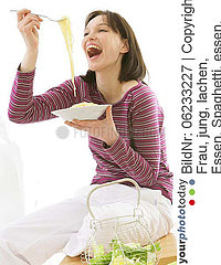 WOMAN EATING STARCHY FOOD